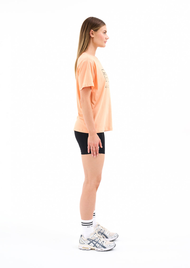 HEADS UP TEE IN CANTALOUPE