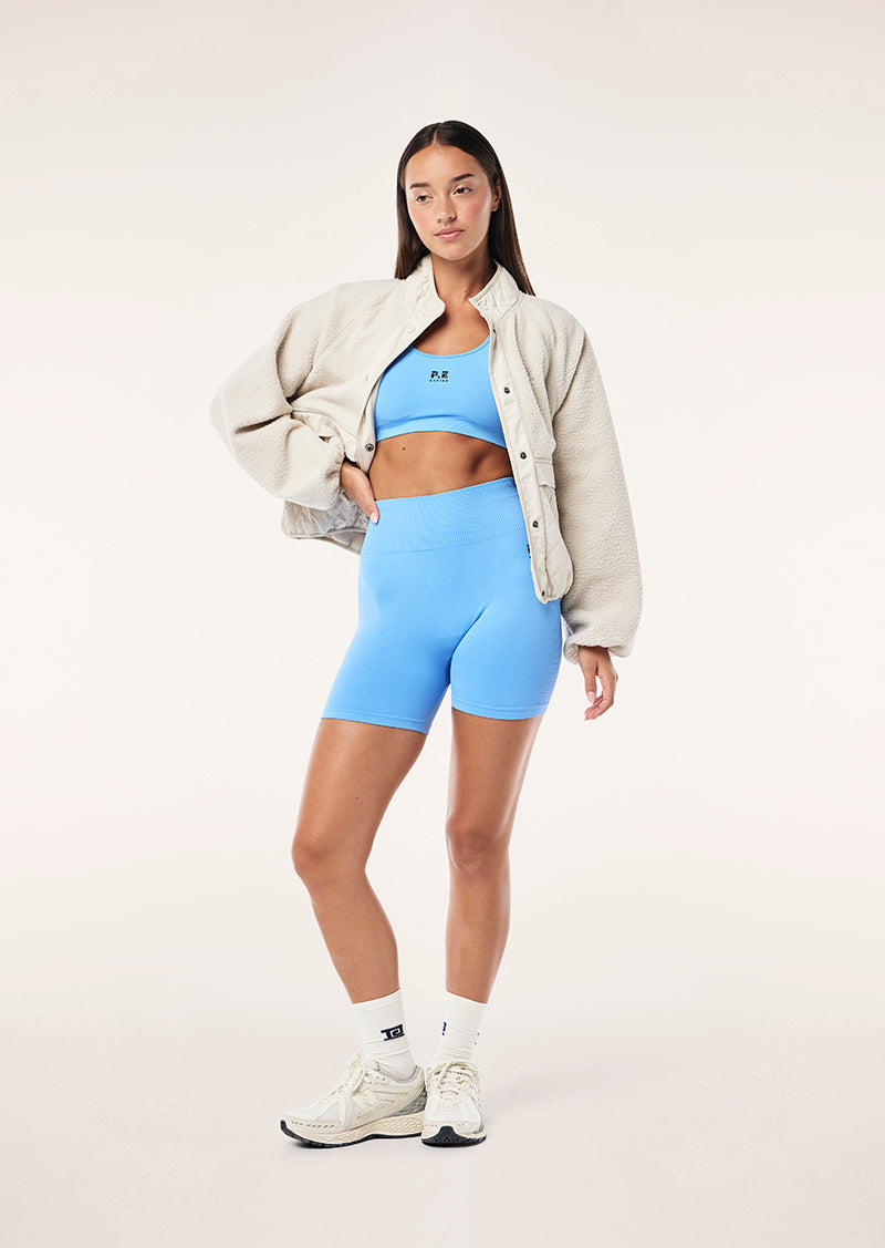 RESTORE SEAMLESS SPORTS BRA IN CORNFLOWER BLUE